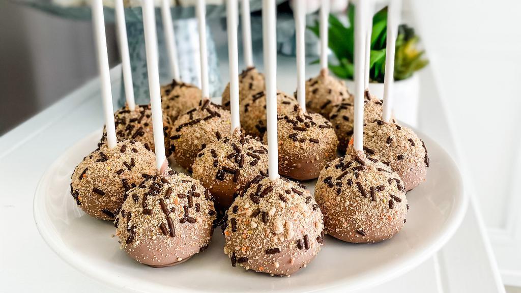 Chocolate Peanut Butter Cake Pop · Chocolate cake combined with creamy peanut butter, coated in milk chocolate, and topped with Reese's Pieces dust + chocolate sprinkles. All cake pops are individually wrapped.