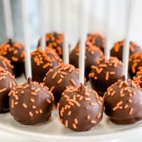 Orange Chocolate Cake Pop · Our moist orange cake dipped in chocolate and covered in orange sprinkles. If you like an or...