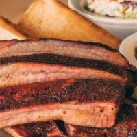 Half Back · A hearty rib dinner that is a fan favorite. Includes a ½ rack of our slow-smoked ribs, 2 del...