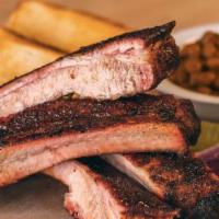 4 Rib Dinner · Includes 4 St. Louis Style Ribs and 2 sides.