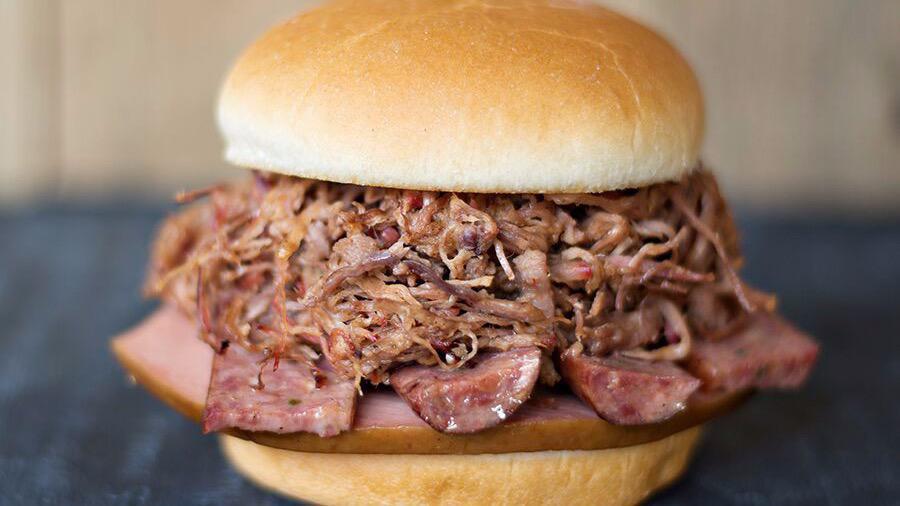 The Heisman · Piled high with bologna, hot links & pulled pork or brisket.