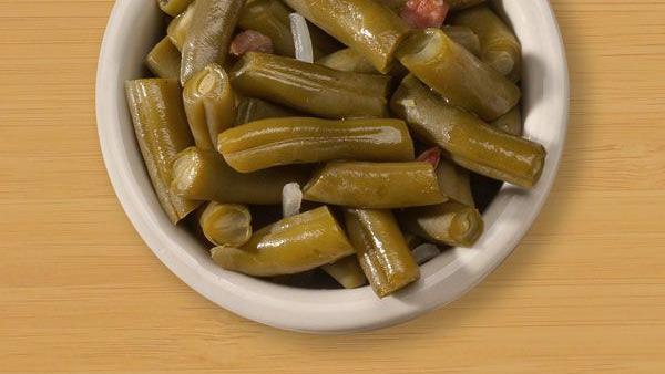 Green Beans · Our slow-cooked green beans are sure to please. did we mention that they have a hint of bacon to give them that little something extra?.