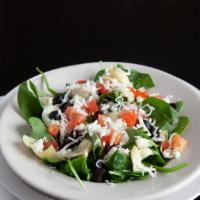 Spinach Salad · Spinach, artichoke hearts, onions, black olives, tomatoes, feta cheese.
