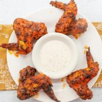 Sicilian Wings · Sicilia Pizza Kitchen favorite: Baked in hot sauce or BBQ sauce dip with ranch or blue cheese.