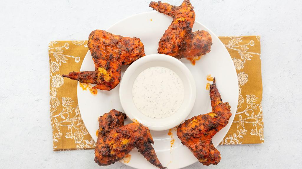 Sicilian Wings · Sicilia Pizza Kitchen favorite: Baked in hot sauce or BBQ sauce dip with ranch or blue cheese.