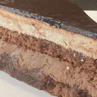 Chocolate Temptation · Chocolate cake filled with chocolate cream,, hazelnut cream and hazelnut crunch.