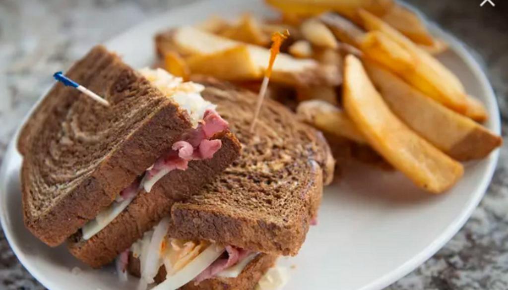 Classic Reuben · Corned Beef, Sauerkraut, . Grilled Onions, Swiss Cheese, . 1000 Island on Marbled Rye