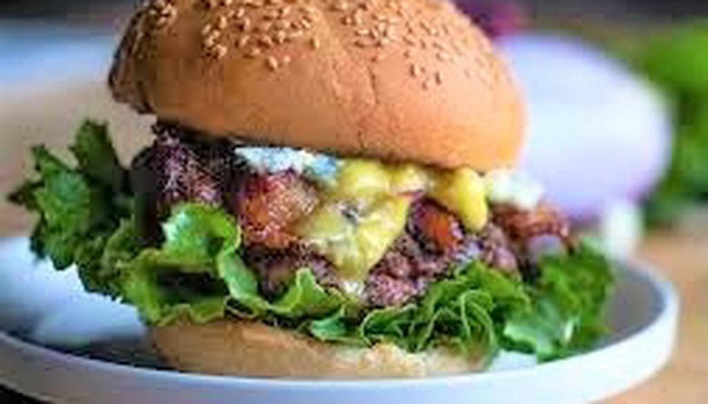Bacon Bleu Burger · 6-ounce  ground Chuck patties made In-House with Bacon, Bleu Cheese Dressing, . Grilled Onions, Lettuce, Tomato