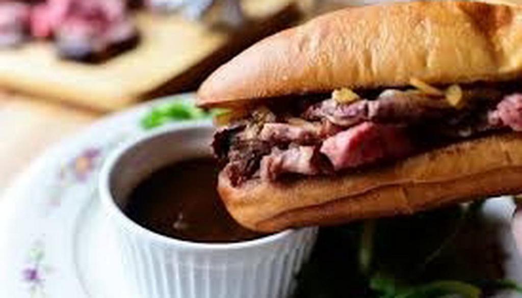 Beef Dip · 6 oz thinly sliced steak, grilled onions,            provolone cheese on a hoagie with Au Jus. Make it 3/4 lb of Steak!