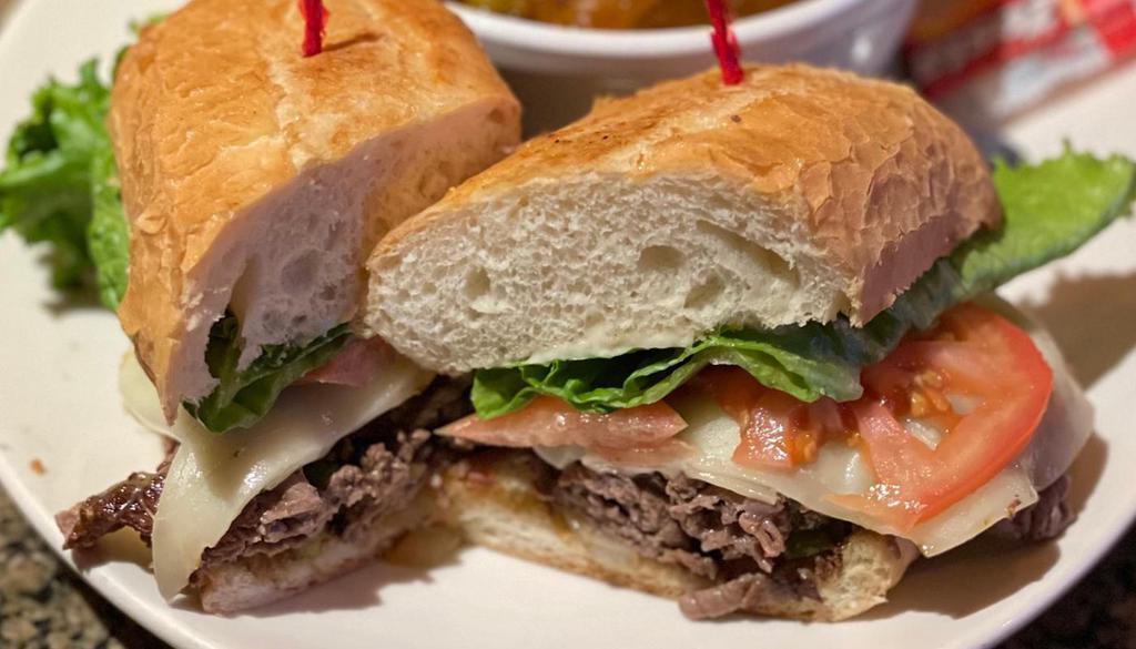 Bookmaker'S Cheesesteak · 6 oz thinly sliced steak with grilled onions,   peppers, mushrooms, Provolone cheese, . lettuce, tomato, house aioli.. Make it 3/4 lb of steak!