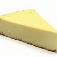 New York Cheesecake · Creamy New York cheesecake with a light graham cracker dusted crust.