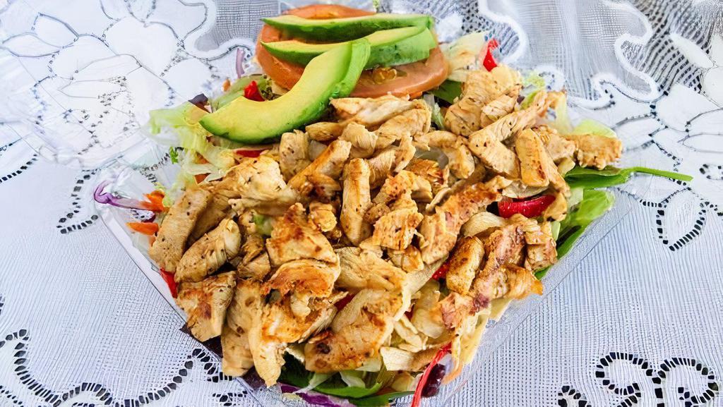 Chicken Salad · Lettuce, tomatoes, spinach, carrots, cabbage, tortilla chips, avocado.