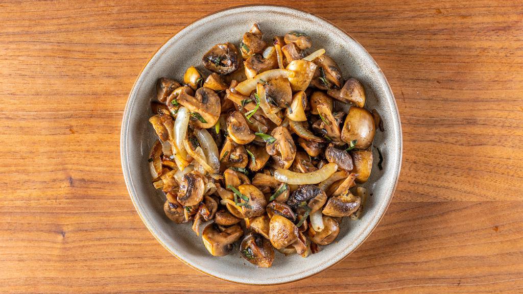 Peppered Mushrooms · Stir fried mushroom medley with curry leaves, spices, onions & garlic.