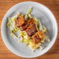 Chashu Pork · Japanese style braised pork belly served with cabbage slaw.