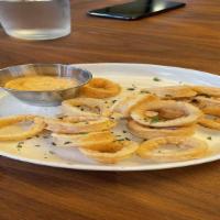 Calamari · Lightly breaded deep fried calamari served with harissa aioli.