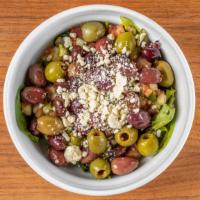 Greek Salad · Mixed greens, cucumbers, tomatoes, onions, feta and olives.