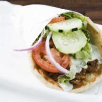 Gyro · Authentic Greek recipe grilled with onions topped with tzatziki sauce, lettuce, tomato, cucu...