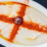 Hummus · Ground garbanzo beans, sesame seed sauce and seasoning.