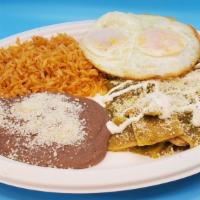Chilaquiles Verdes Con Huevo · Over-easy eggs chilaquiles. Green chilaquiles with two over-easy eggs. Served with rice, bea...
