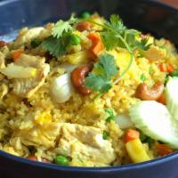 Pineapple Fried Rice  · Fried rice with onions carrots peas fresh pineapple and cashews. choice of chicken or veggie...