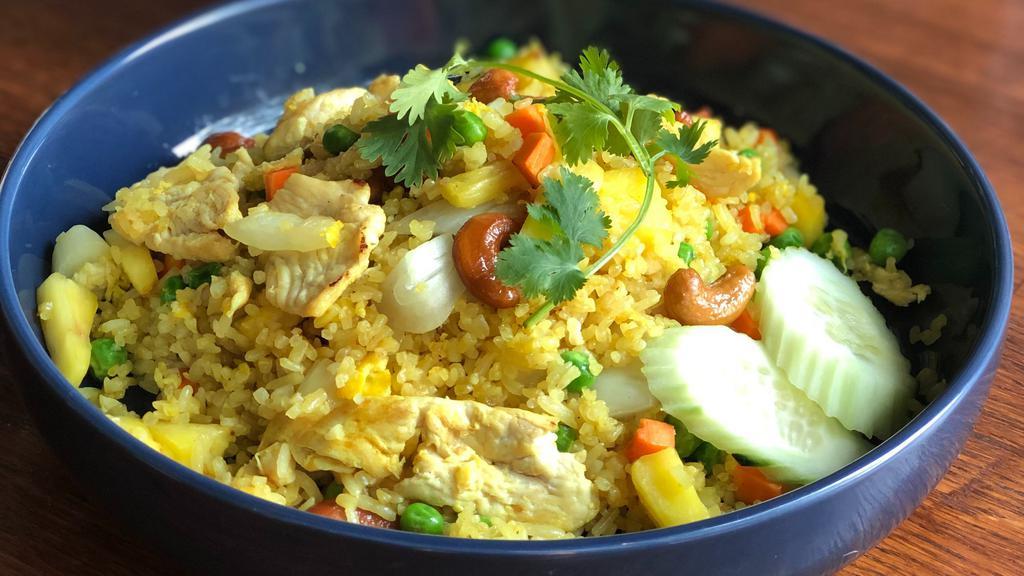 Pineapple Fried Rice  · Fried rice with onions carrots peas fresh pineapple and cashews. choice of chicken or veggies and tofu