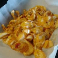 Sidewinder Chili Cheese Fries · Sidewinder Cut Fries topped with Pork Green Chili, Pepper Jack Cheddar Cheese