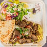Gyro Dish Platter · (Lamb / beef) or chicken. Choice of meat on top of rice, Greek salad and tzatziki and pita.