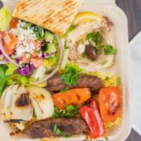 Lamb/Beef Kebab Platter · Charbroiled ground (lamb and beef) with onions, parsley and spices. Served with rice, Greek ...