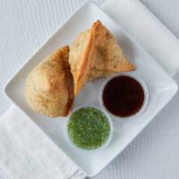 Vegetable Samosa · Veggie, vegan, what's good. Two Indian pastries stuffed with delicately spiced mashed potato...