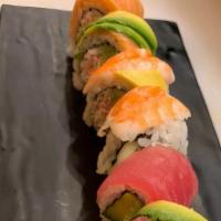 37-Rainbow · Crab stick, avocado, cucumber topped with tuna, salmon, ebi shrimp.