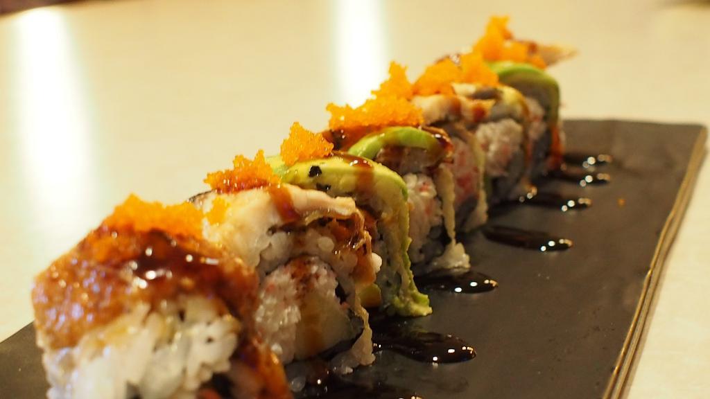 46-Crazy Dragon · Crab meat, cucumber topped w/eel and avocado w/eel sauce and tobiko.