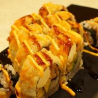 57-New Golden Drangon · 2 Tempura shrimp, cream cheese, peanut, yamagobo and avocado topped w/crunch, tobiko, srirac...