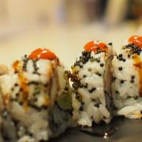 55-Holloween Festival · Eel, crab meat, avocado, cream cheese inside, black tobiko finished w/spicy eel sauce outside.