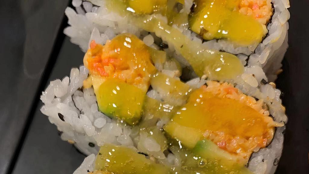 27-Mango Roll · Spicy crab meat, avocado topped with mango sauce.