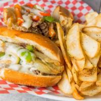 Philly Cheese Steak · Thinly sliced ribeye steak, sautéed onions, peppers, and Provolone.