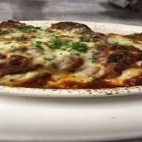 Eggplant Rollatini · Thinly sliced breaded eggplant filled with Ricotta, Mozzarella and baby spinach.