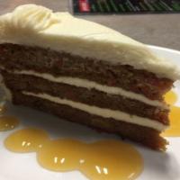 Carrot Cake · Three layers of cake loaded with shredded carrots, pecans, and crushed pineapple.