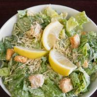 Caesar Salad With Chicken · Romaine lettuce tossed with Caesar dressing, croutons, lemon and Parmesan cheese. Served wit...