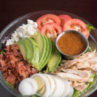 Cobb Salad · Chicken breast, avocado, blue cheese, bacon, tomato, egg and lettuce with Italian dressing.