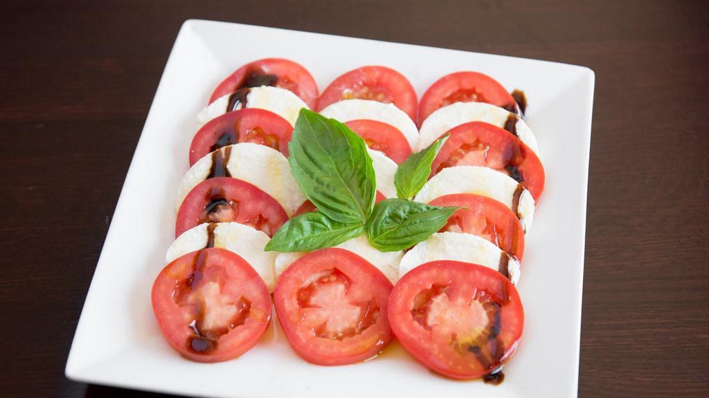 Caprese Salad · A true Italian salad made with fresh mozzarella, fresh basil, tomatoes and extra virgin olive oil.