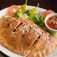 Meat Calzone · Pepperoni, Canadian bacon and salami with pizza sauce, ricotta and mozzarella. Served with m...