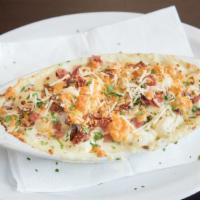 Gnocchi Gorgonzola · Italian potato dumplings, prosciutto, fresh basil and creamy Gorgonzola sauce. Served with g...