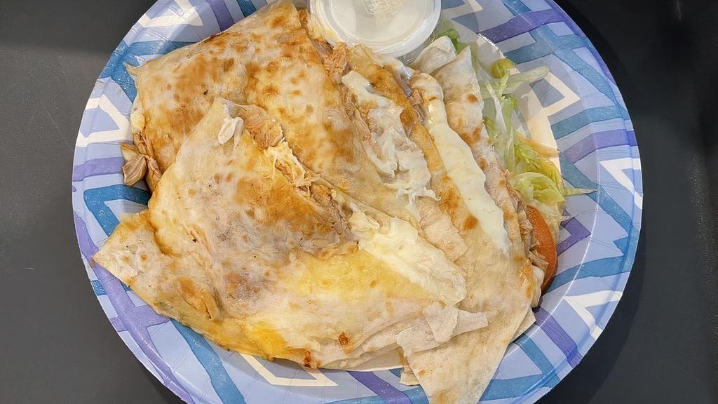 Quesadillas · Choose of meat, side of lettuce, tomato and sour cream.
add a $2.00 for specialty meat.