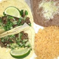 Taco Plate · Two tacos filled with your choice of meat. Served with rice and beans.