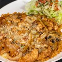 Arroz Con Pollo · Chunks of chicken simmered in our special salsa with mushrooms, served on a bed of rice and ...