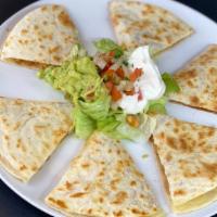 Deluxe Quesadilla · Two 10” flour tortillas grilled with jack cheese, with your choice of meat. With the additio...