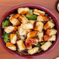Tofu Bowl · Tofu teriyaki served bowl style with steamed rice and vegetables.