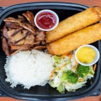Chicken Teriyaki & Egg Rolls · Chicken Teriyaki served with 2 egg rolls and a side of steamed rice and steamed vegetables.