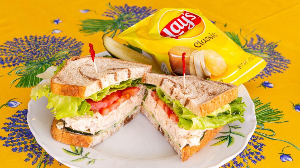Albacore Tuna Sandwich · Made with water chestnuts. Choose one side, chips, potatoes or pasta salad.