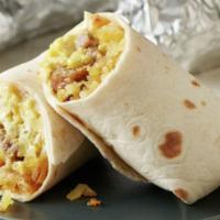 Breakfast Burrito · 14 in. flour tortilla with scrambled eggs with beans, french fries. cheese, pico de gallo, g...